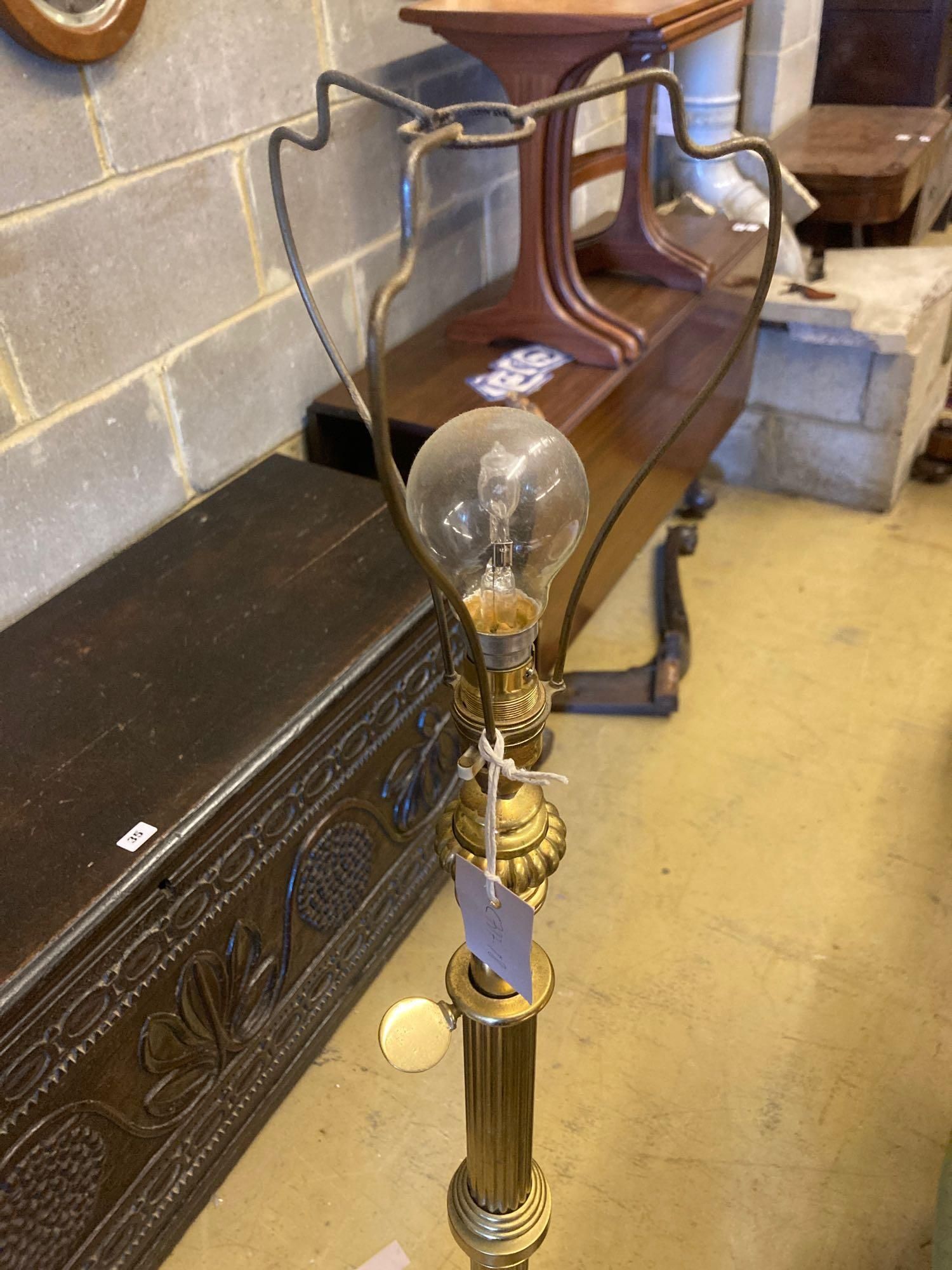 An Edwardian lacquered brass telescopic lamp standard